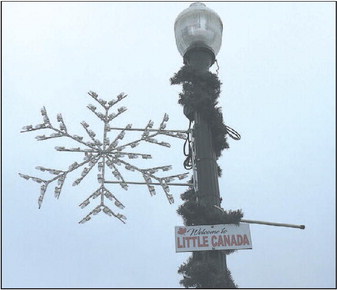 Sign Welcomes Visitors To  “Little Canada”